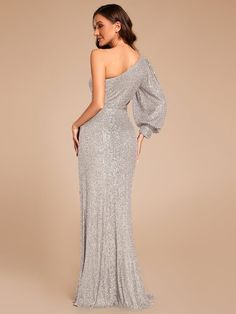 This dress combines sophistication and allure with its asymmetrical one-shoulder style and luxurious sequin fabric. The single long sleeve with a dramatic puff adds a fashionable twist, while the cutout at the waist and thigh-high slit create a flattering and sexy silhouette.
Length: Floor length.
Sleeve Style: Long sleeves.
Closure: It is concealed a zipper up the back.
Undergarments: It is padded, with lining.
Fabric:The garment comprises sequin.
Stretch: Fabric is no stretch. Formal Evening Dress, Ever Pretty, Sequin Fabric, Formal Evening Dresses, Evening Dress, Floor Length, Sleeve Styles, Custom Sizing, Evening Dresses