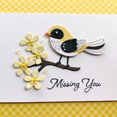 a card with a bird and flowers on it