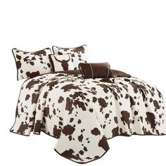 a brown and white cow print comforter set