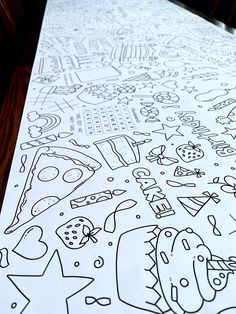 a large sheet of paper that has some drawings on it