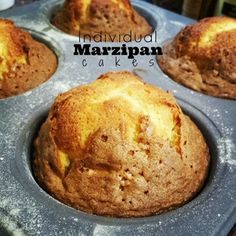 several muffins in a metal pan on a table