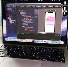 an open laptop computer sitting on top of a desk