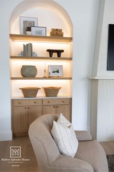 a living room filled with furniture and a flat screen tv mounted on a wall above it