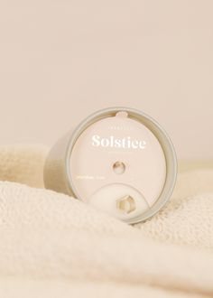 a white towel with the label solstice on it's front and side