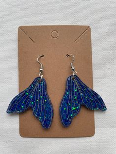 *MADE TO ORDER* Mermaid tail earrings made of resin.  *DISCLAIMER* Do not leave resin out in heat for an excessive amount of time. Heat will cause resin to bend, melt, and become discolored. Mermaid Tail Earrings, Resin Mermaid, Sea Earrings, Ocean Earrings, Mermaid Tale, Mermaid Earrings, Mermaid Tail, Epoxy Resin, Bend