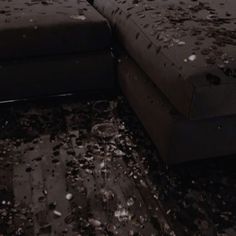 a couch that is sitting in the middle of a room with lots of confetti all over it