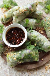 some food is sitting on a plate with dipping sauce