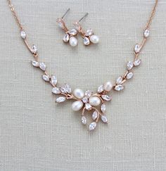 a necklace and earring set with pearls