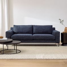 a living room scene with focus on the couch and coffee table