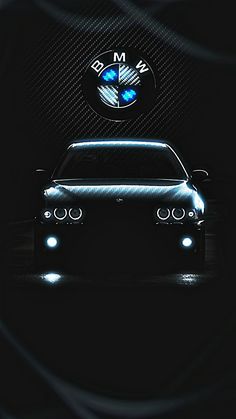 a bmw car is shown in the dark