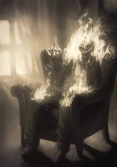 a person sitting in a chair with fire coming out of it