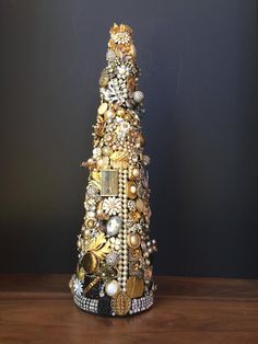 a christmas tree made out of jewelry on a table