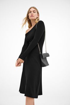 Our Angela Dress is a study in casual refinement. An eloquent extension of our Murray Top, Angela emerges as a midi silhouette with an off-shoulder neckline and long sleeves, marked by a diagonal seam that intersects her fitted top and a-line skirt. Fashioned from soft & sustainable European jersey, Angela only gets better with time.[SPLIT] Maritza, in black, is 5'9.5" (177 cm) tall, wearing size XS. Yada, in chestnut, is 5'9" (175 cm) tall, wearing size XS. Approximately 44" (112 cm), measured Formal Fall Asymmetrical Dress With Asymmetrical Neckline, Formal Asymmetrical Dress With Asymmetrical Neckline For Fall, Formal Asymmetrical Dress For Fall, Chic Long Sleeve Off Shoulder Formal Dress, Fall One Shoulder Long Sleeve Dress, Fall Long Sleeve One Shoulder Dress, Chic Long Sleeve Asymmetrical Dress For Night Out, Chic Long Sleeve Off Shoulder Dress For Cocktail, Chic One Shoulder Long Sleeve Dress For Date Night