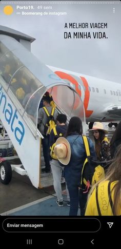 some people are boarding an airplane and getting ready to board the plane with their luggage