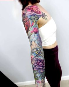 a woman's arm with flowers on it