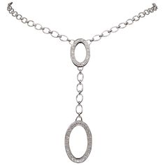 Approximately 1.30CTW diamond oval drop necklace crafted in 18k white gold. Diamond Carat Weight: Approximately 1.30CTW Diamond Cut: Round Brilliant Cut Color: Average G-I Clarity: Average VS Metal: 18K White Gold Approximate Drop Length: 3 3/16” Long Necklace Length: Approximately 17.5" Long Marked/Tested: Stamped "18K" Weight: 17 Grams Formal Oval Diamond Necklace In Platinum, Luxury Oval Link Diamond Necklace For Formal Occasions, Formal Platinum Diamond Necklace With Oval Shape, Formal Oval Platinum Diamond Necklace, Luxury Oval Diamond Necklace With Polished Finish, Luxury Silver Diamond Necklace With Oval Pendant, Oval Diamond Necklace With Polished Finish, Formal Oval Pendant Diamond Necklace With Single Cut Diamonds, White Gold Oval Diamond Necklace With Pave Setting