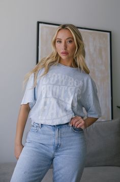 This Cowboy Boots & Faded Jeans Graphic Tee is perfect for a laid-back western look. It has a relaxed fit and features a stylish cowboy boot and jean design. Perfect for the rodeo or for any casual country style. baby blue fabric true to size / relaxed fit 100% cotton machine wash cold Western Style Washed Tops With Relaxed Fit, Western Style Washed Top With Relaxed Fit, Casual Denim Top For Rodeo, Casual Distressed Tops For Rodeo, Casual Medium Wash Top For Rodeo, Western Style Relaxed Fit Medium Wash Tops, Relaxed Fit Denim Tops For Rodeo, Casual Relaxed Fit Tops For Rodeo, Light Wash Tops For Rodeo In Spring