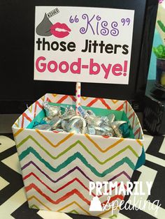 there is a box with candy in it on the table next to a sign that says those jitters good - bye