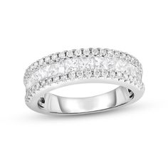 a white gold ring with diamonds on the sides and two rows of stones in each band