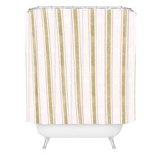 a shower curtain with gold and white stripes