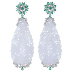 These stunning hand carved Jade earrings are thoughtfully and meticulously crafted in 18-karat white gold. It is set in 63.35 carats Jade, 2.04 carats emerald and 1.92 carats of sparkling diamonds. FOLLOW MEGHNA JEWELS storefront to view the latest collection & exclusive pieces. Meghna Jewels is proudly rated as a Top Seller on 1stDibs with 5 star customer reviews. All items manufactured by us are handmade and can be customized or redesigned. Composition Size-78X26 MM Total Weight-26.72 Gold Weight(Gms)-13.258 Diamond Wt(Cts)-1.92 Emerald Wt(Cts)-2.04 Jade Wt(Cts)-63.35 Dna Earrings, Diamond Chandelier Earrings, Carved Jade, Diamond Dangle Earrings, Jade Earrings, Earrings Diamond, Gold Diamond Earrings, Jade Carving, White Gold Earrings