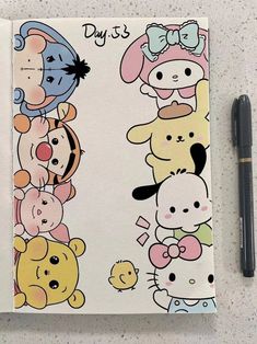 a notebook with cartoon characters on it next to a pen