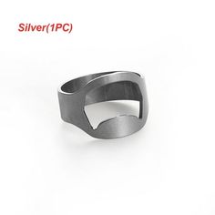 a silver ring sitting on top of a white surface