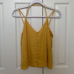 Nwt! Yellow-Gold Strappy Tank Top With Sewn In Design And (Fake) Buttons! Super Cute For The Summer! Yellow Tank Top For Spring Vacation, Yellow Tank Top For Vacation And Spring, Yellow Tank Top For Vacation In Spring, Yellow Cami Top For Summer, Yellow Summer Tank Top For Day Out, Mustard Tank Top For Spring, Yellow Cami Tank Top For Beach, Yellow V-neck Tank Top For Summer, Yellow Cami Tank Top For Day Out