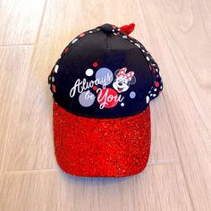 Disney Parks Black And Red Sparkly And Polka Dotted Minnie Mouse Hat With Red Sequin Bow On Back And Adjustable Velcro Closure. Never Worn, In Great Condition Size Youth 54-58cm Questions? Leave A Comment Below! Red Mickey Mouse Adjustable Hat, Adjustable Red Mickey Mouse Hat, Casual Black Mickey Mouse Hat, Black Adjustable Minnie Mouse Hat, Adjustable Black Minnie Mouse Hat, Disney Junior Mickey Mouse, Girl Baseball Cap, Snow White Seven Dwarfs, Baby Minnie