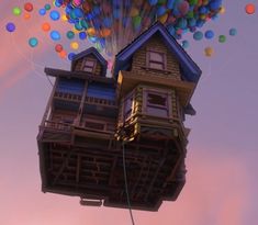 the house is floating in the air with balloons