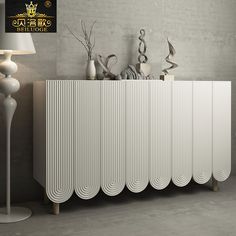 a white radiator sitting next to a lamp on top of a table in front of a wall