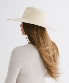 Indulge in effortless sophistication with this fedora style featuring a wide relaxed brim. The intricately hand-woven Panama straw exudes a luxe look + feel that is sure to keep you stylishly shaded from the summer heat while staying light + breezy. Luxury Fedora Straw Hat For The Beach, Luxury Fedora Straw Hat For Beach, Luxury Wide Brim Fedora For The Beach, Luxury Wide Brim Fedora For Beach, Luxury Brimmed Summer Hats, Luxury Straw Hat With Short Brim For Beach, Luxury Summer Hat With Curved Brim, Luxury Short Brim Straw Hat For The Beach, Luxury Short Brim Straw Hat For Beach