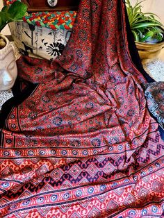 "Update! - Zynah covered by LBB - https://lbb.in/bangalore/zynah-designs-handloom-sarees/ Ajrakh cloth carries many meanings. The popular story amongst local printers is that Ajrakh means \"keep it today.\" It is also linked to azrakh, the Arabic word for indigo, a blue plant which thrived in the arid ecology of Kachchh until the 1956 earthquake. Ajrakh patterns use complex geometry to create starry constellations in indigo, madder, black, and white across lengths of cloth. The shapes and motifs Bohemian Silk Sets With Kalamkari Print, Bohemian Tussar Silk Saree With Batik Print, Bohemian Silk Choli With Bandhani Print, Bohemian Bandhani Pre-draped Saree For Navratri, Bohemian Bandhani Print Pre-draped Saree For Navratri, Red Bohemian Blouse Piece With Bandhani Print, Bohemian Pre-draped Red Saree With Bandhani Print, Bohemian Style Unstitched Saree With Bandhani Print, Unstitched Bohemian Saree With Bandhani Print