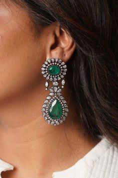 Gorgeous victorian rhodium plated CZ Chaandbali With Lab Emerald Doublet stones and highest quality Korean CZ stones Lightweight and elegant Can be paired with any dress Length: Approx 2.5 inches Closure: Pushback Customized orders takes 3 to 4 weeks, depending on piece requirements. The Ombre Designs Jewelry pieces can be customized in accordance with your requirement. Please Email or Whats app on : +91 8448833193 / sonalikamehra [!at] theombredesigns.com Luxury Green Elegant Jhumkas, Bollywood Style Heavy Chandelier Earrings For Formal Occasions, Heavy Bollywood Chandelier Earrings For Formal Events, Heavy Bollywood Chandelier Earrings For Formal Occasions, Elegant Chandelier Earrings With Stone Work For Eid, Formal Bollywood Chandbali Chandelier Earrings, Bollywood Chandbali Chandelier Earrings For Formal, Bollywood Chandbali Chandelier Earrings For Formal Occasions, Bollywood Style Heavy Chandbalis For Formal Occasions