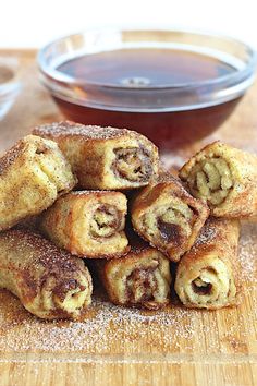 there are pictures of different pastries and sauces on the table, including cinnamon rolls