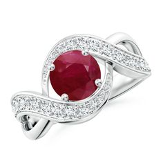 an oval ruby and diamond ring with white diamonds on the band, set in 18k white gold