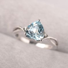 ◆ The sweetheart ring features the dainty sky blue topaz, with tiny zircons decorated beside the main stone. The curved band adds tenderness to the whole design of the ring. ◆ Production Description: Main stone Type: Sky Blue Topaz Main Stone Shape: Heart Cut Side stone: CZ Metal: 925 Sterling silver - Other options available in the drop down menu ◆ Customization: √Free for Add Engraving √Other Metal Type Available √Other Gemstones & Shapes Available √Personalization Requests Available ◆ Pac Sky Blue Topaz Ring, Green Sapphire Ring, Engagement Ring Prices, Asscher Cut Diamond, Minimalist Engagement Ring, London Blue Topaz Ring, Half Eternity Ring, Sky Blue Topaz, Rose Engagement Ring