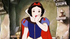 snow white is holding her hand to her face