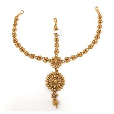 Gold plated ethnic Indian Bollywood tstyle head or hair ornament jewelry. Traditional pear shape with gold bead drop. Attach with bobby pin in the hair. Metal: Alloy Plating: 5K (1gm) Gold Chain Length: 3.25 Inch plus Fish Hook: 0.25 Inch Ornament: Length: 1.94 Inch Width: 1 Inch Gold plated ethnic Indian Bollywood tstyle head or hair ornament jewelry. Traditional pear shape with gold bead drop. Attach with bobby pin in the hair ALL OCCASION - Bridal, Wedding, Party, Dance Dandiya, Garba, Eid, Diwali and Gifts Meticulously Curated and Checked in USA Handcrafted by artisans in India Style Tip: From casual look to bridal wear depending on your style and occasion. Wear it in the center of forehead as shown in the picture Jewelry Care: Can be used in water but dry completely before storing Eth Adjustable Gold Hair Accessories For Festivals, Adjustable Gold Hair Accessories For Festive Occasions, Traditional Gold Hair Accessories For Festive Occasions, Bohemian Gold Headpieces For Festivals, Traditional Gold Headpieces For Festivals, Ceremonial Temple Jewelry Tikka, Gold Tikka With Tilla For Rituals, Gold Beads Jewelry For Puja, Temple Jewelry Tikka For Ceremonial Occasions