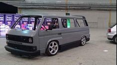 a grey van parked in a parking garage