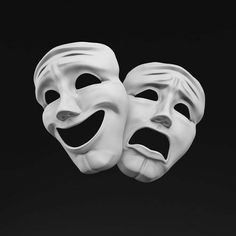 two white masks with faces painted on them are in the shape of people's mouths