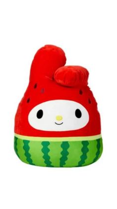 a red and green beanie with a cute face on it's head,