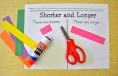 a pair of scissors and some tape on top of a piece of paper that says shorter and longer