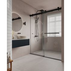 a bathroom with a walk in shower next to a white sink and mirror on the wall