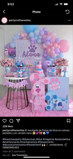 a pink and blue party with balloons on the wall, teddy bear tablecloths and decorations