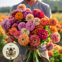 a man holding a large bouquet of flowers in his hands with a bee on it