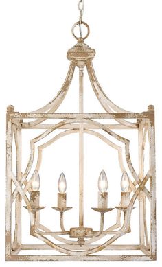 a chandelier with four lights hanging from it's center frame and two small candles