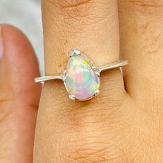 Vintage Opal Ring, Opal Engagement Ring, 925 Sterling Silver Opal Ring, Pear Shape Opal Ring, Fire Opal CZ Rings, Opal Ring Jewelry This 925 sterling silver vintage lab created opal rings is elegant . Best jewelry for women, girls to attend parties, weddings or any other activities. Product Details- Metal- 925 Sterling Silver Gemstone- Fire Opal Gemstone Shape- Pear Setting- Bezel Production Time: Each of our pieces are made to order. Due to this, it takes 3 to 5 business days after your payment Sterling Silver Teardrop Opal Ring, Sterling Silver Teardrop Crystal Gemstone Ring, Teardrop Opal Ring In Sterling Silver, Elegant Teardrop Opal Ring In Sterling Silver, Silver Teardrop Opal Ring In Sterling Silver, Silver Pear-shaped Opal Gemstone Ring, Sterling Silver Pear-shaped Gemstone Ring, Pear-shaped Moonstone Ring In Sterling Silver For Gift, Pear-shaped Moonstone Ring In Sterling Silver