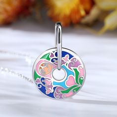 Fusing an ebullient allure with refined craftsmanship, we presents this pendant. Artfully forged from sterling silver, the piece is encircled with a colorfule enamel ring to enliven your everyday edits. You can't help but smile looking at this enamel smiley face necklace.Weight: 5.38 gWidth: 21.2 mmHeight: 30.9 mmThickness: 8.2 mmMaterial: 925 SilverStone Type: Jeulia® StonePlating Color: Silver Smiley Face Necklace, Dreamy Garden, Face Necklace, Enamel Ring, Necklace Online, Smiley Face, Sterling Silver Necklace, Quality Jewelry, Sterling Silver Necklaces