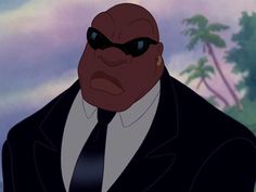 an animated man in a suit and tie with sunglasses on his face, staring at the camera